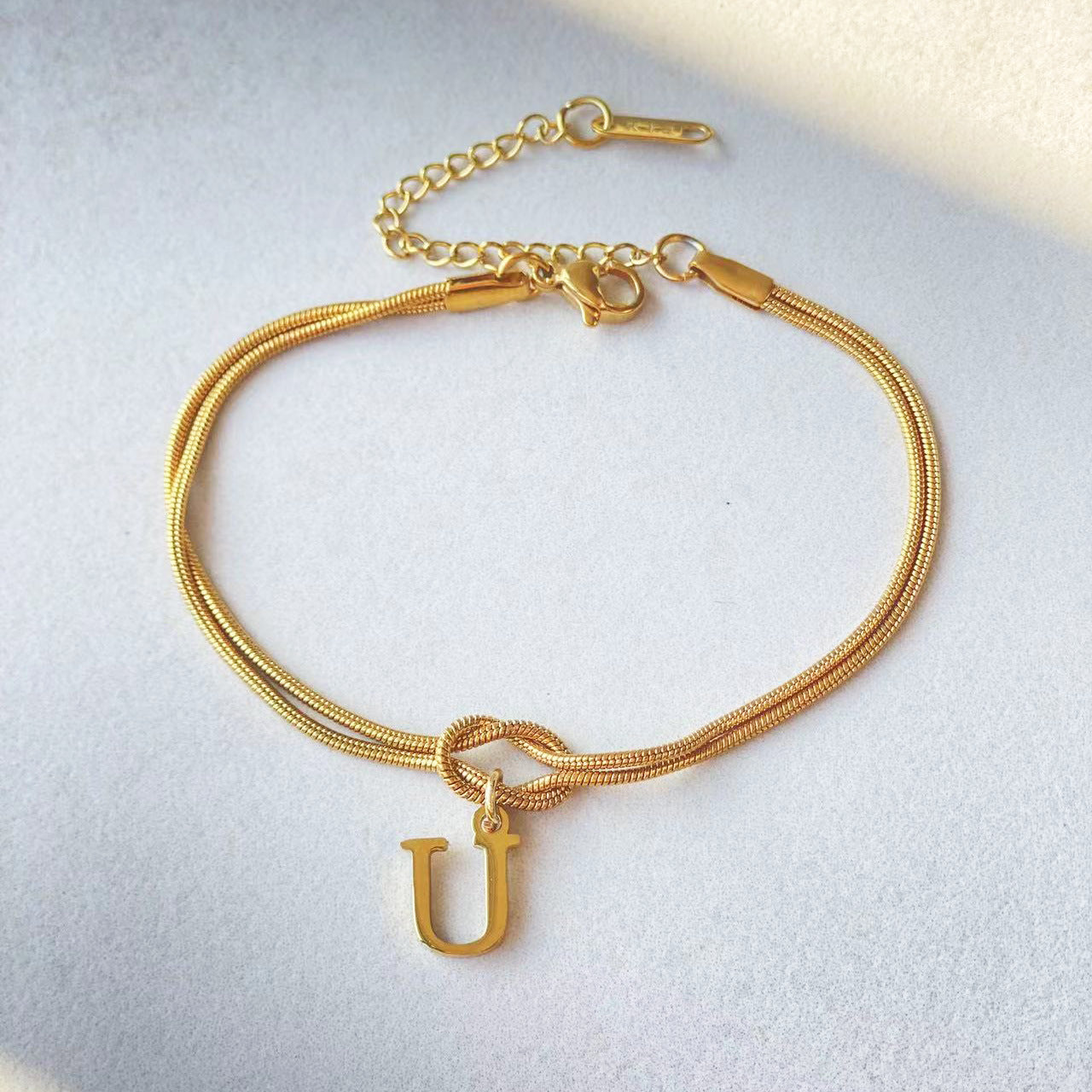 Golden initial bracelet